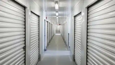 A perspective view down a corridor of storage units