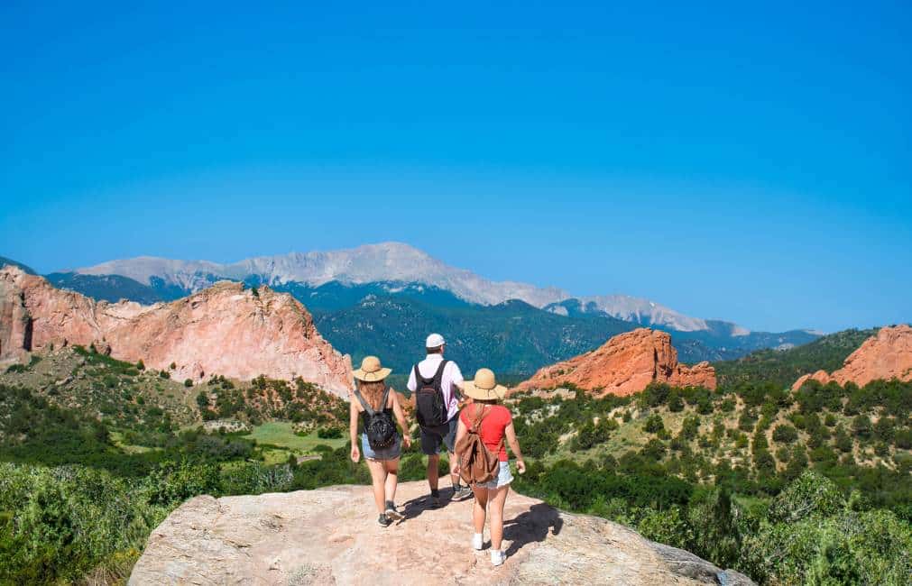 Family of three hiking in Colorado Springs.